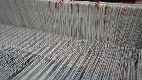 Close up of multicolored thread spools and yarn rolls for professional garment Stock Footage 334436519