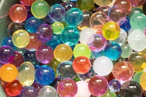A close-up of multicolored transparent balloons. A bright background of col.. Stock-Fotos