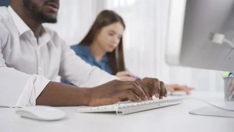 Close-up of multiethnic colleagues working together in office. Stock Footage 228806213