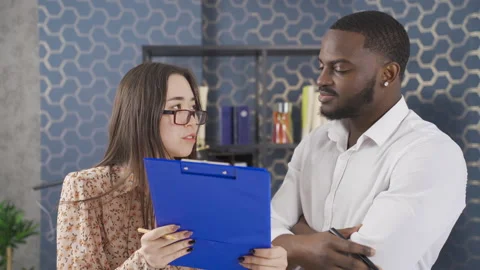 Close-up of multiethnic colleagues working together in office. Stock Footage 228806667