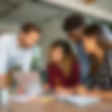 Close-Up of Multiethnic Creative Team Brainstorming Strategy Over Laptop Stock Photos
