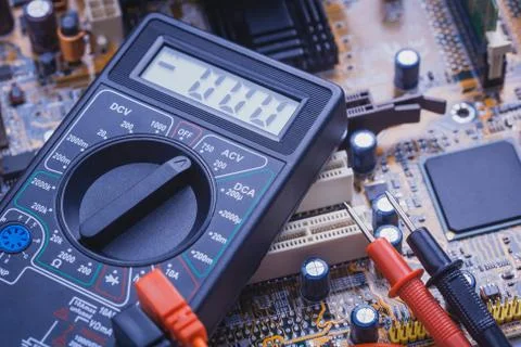 Close-up of multimeter on PCB plate Stock Photos