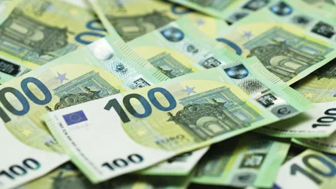 Close-up of multiple 100 euro banknotes stacked together Stock Footage 328046343