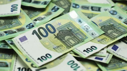 Close-up of multiple 100 euro banknotes stacked together Stock Footage 328046474