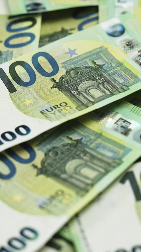 Close-up of multiple 100 euro banknotes stacked together, showcasing intricate Stock Footage 328124687