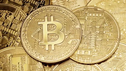 Close-up of multiple Bitcoin coins highlighting cryptocurrency and digital Stock Footage 312601141