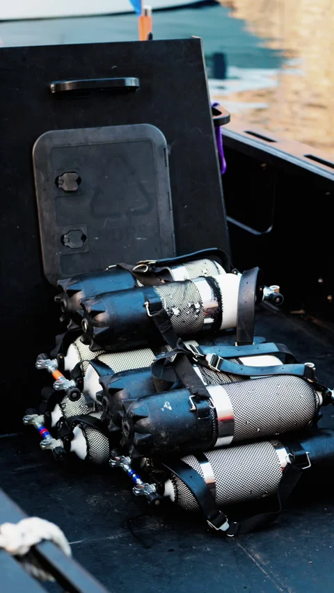 Close up of multiple blue and gray air tanks on a boat. Vertical Stock Footage 304294574