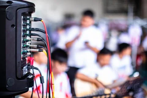 Close-up of multiple cables and wires plugged into the back of an audio amp.. Stock Photos