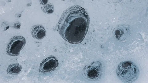 Close-Up of Multiple Cryoconite Holes Stock Footage 292942325