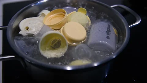 Close-up of multiple Medela breast pumps accessories boiling hygienic process Stock Footage 153476947
