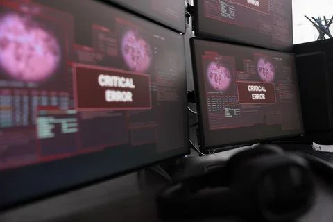 Close up of multiple monitors having critical error message on display Stock Photos