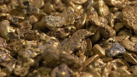 Close-up of multiple rich gold nugget pieces extracted from the ore mine Stock Footage 204995355