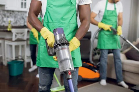 Close up of multiracial people doing cleaning of room Stock Photos