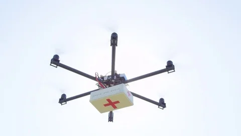 CLOSE UP: Multirotor cargo drone delivering first aid package, landing from sky Stock Footage 81136741