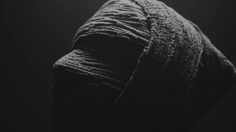 Close up of A Mummy looking around in a dark room 库存影片 259612335