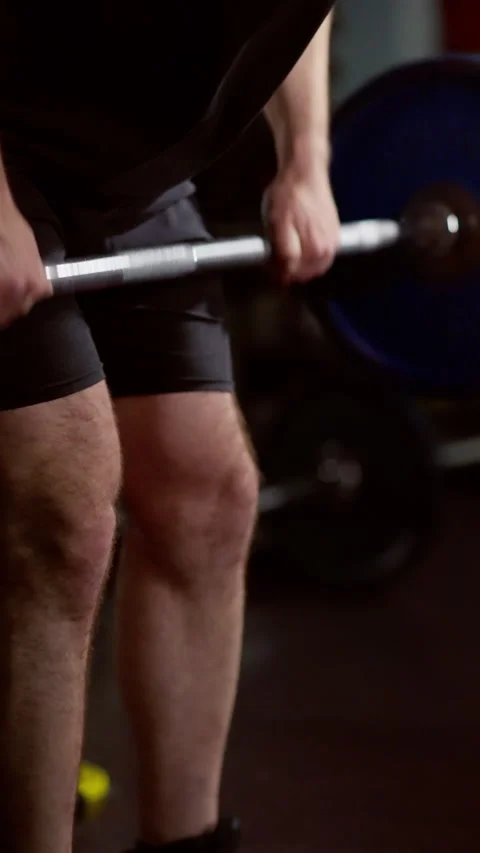 Close-up of a muscular man with a full beard and shaved head, wearing a black Stock Footage 276192851