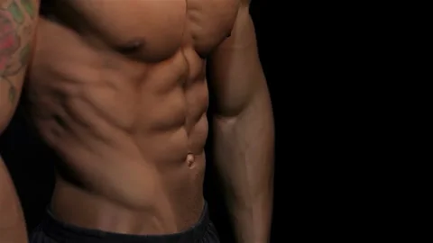 Close-up of a muscular man showcasing impressive abs Stock Footage 311672974