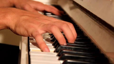 Close-up of a music performer's hand playing the piano Stock Footage 139498806