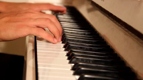 Close-up of a music performer's hand playing the piano Stock Footage 139498824