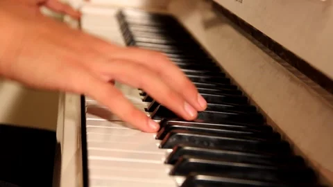 Close-up of a music performer's hand playing the piano Stock Footage 139498860