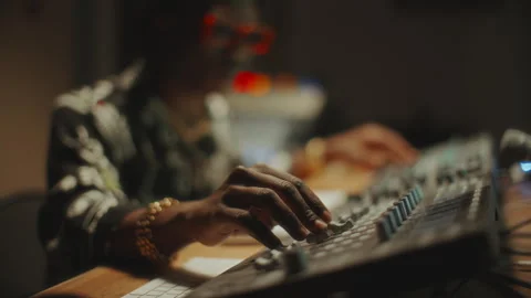 Close-Up of Music Producer Adjusting Knobs Audio Mixer in Recording Studio 스톡 동영상 302710046