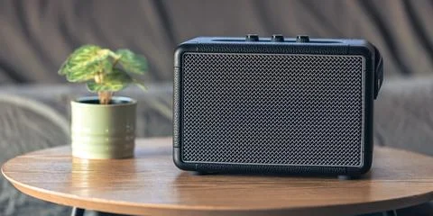 Close up, music speaker on a table in the interior of a room. Stock Photos