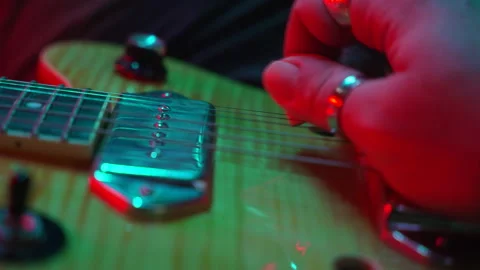 Close-up of a musician's hand playing a fast rock solo on an electric guitar Video stock 335464439
