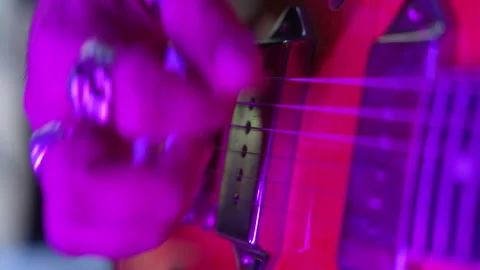 Close-up of a musician's hand playing a fast rock solo on an electric guitar Video stock 335464583