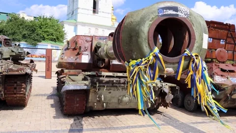 Close up Muzzle of a Tank on Display with Destroyed Russian Military Equipment Stock Footage 273176236
