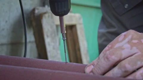 Close-up of a Nail Being Tightened with a Screwdriver in Slow Motion Vídeo Stock 252206601