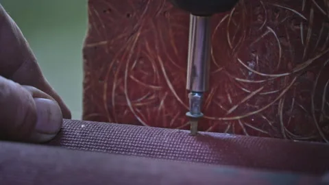 Close-up of a Nail Being Tightened with a Screwdriver in Slow Motion Vídeo Stock 252650138