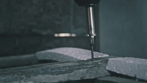 Close-up of a Nail Being Tightened with a Screwdriver in Slow Motion Stock Footage 252653072