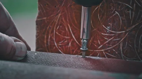 Close-up of a Nail Being Tightened with a Screwdriver in Slow Motion Stock Footage 254665708