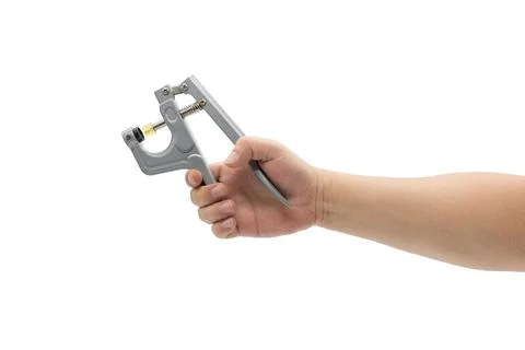 Close-up of nail button pliers tool in hand Stock Photos