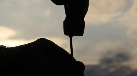 Close up of nail hammering slow motion with beautiful sky background Видео 47479134