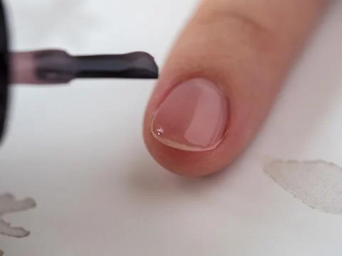 Close-up of the nail Polish application process. Selective focus. Nail care Stock Photos