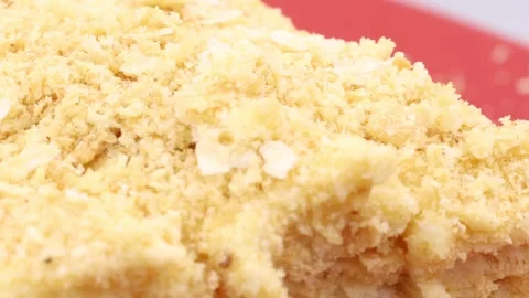 Close-up of a Napoleon cake slice rotating, showcasing its flaky layers. Stock Footage 299089592