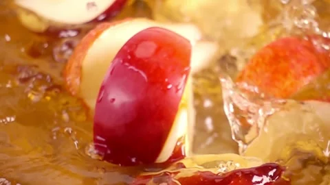 Close up of natural apple, pears quarters falling in juice, advertising of .. Stock Footage 305785038