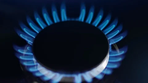 Close up natural blue burning flame of gas stove high angle. Shot on RED Raven Stock Footage 127080745