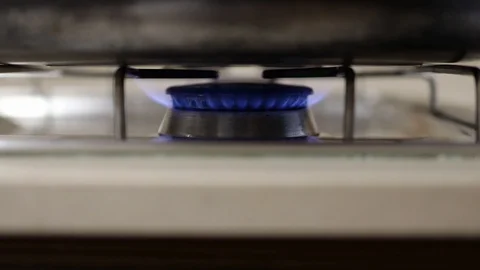 Close up of natural blue burning flame of gas stove Stock Footage 127381706