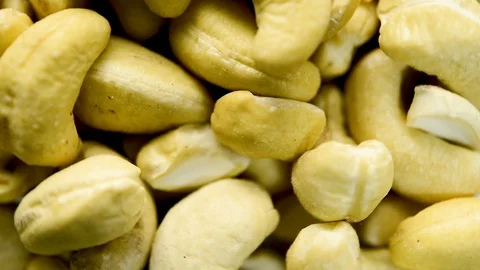 Close up of natural cashew nuts rotating. Flat plane. Top view Vídeos de archivo 105213550