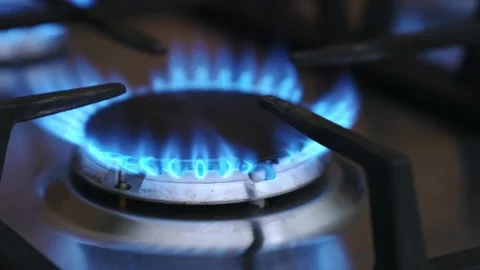 Close-up natural gas flame on kitchen gas stove. Stock Footage 220136323