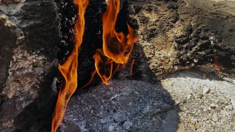 Close Up of Natural Gas Source in Wild Nature from Stones Rock. Chimera Eternal Stock Footage 183420690