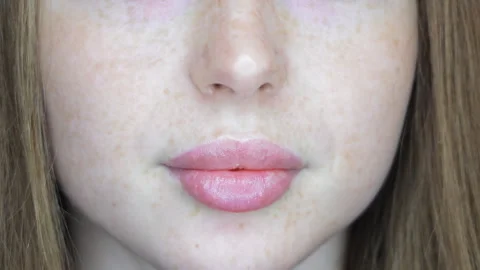 Close-up of natural lips with healed permanent makeup result, subtle pink Stock Footage 307521454
