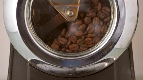Close-Up: Nearly-Roasted Coffee Beans Rotating in Home Roaster, Slow Motion Stock Footage 247660779