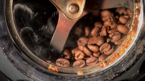 Close-Up: Nearly-Roasted Coffee Beans Rotating in Home Roaster, Slow Motion Stock Footage 247660781