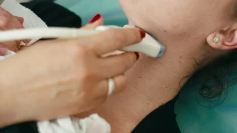 A close-up of the neck along which the sensor of the ultrasound device is guided Stock Footage 272755014