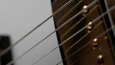 Close-up of the neck and pickup of a white classic electric guitar Stock Footage 155637848