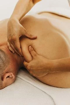 Close up of neck massage therapy session. Female massage therapist's hands. 스톡 사진