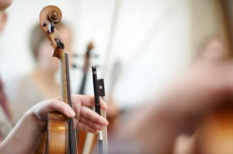 Close-up of the neck of a violin with a bow Stock Photos